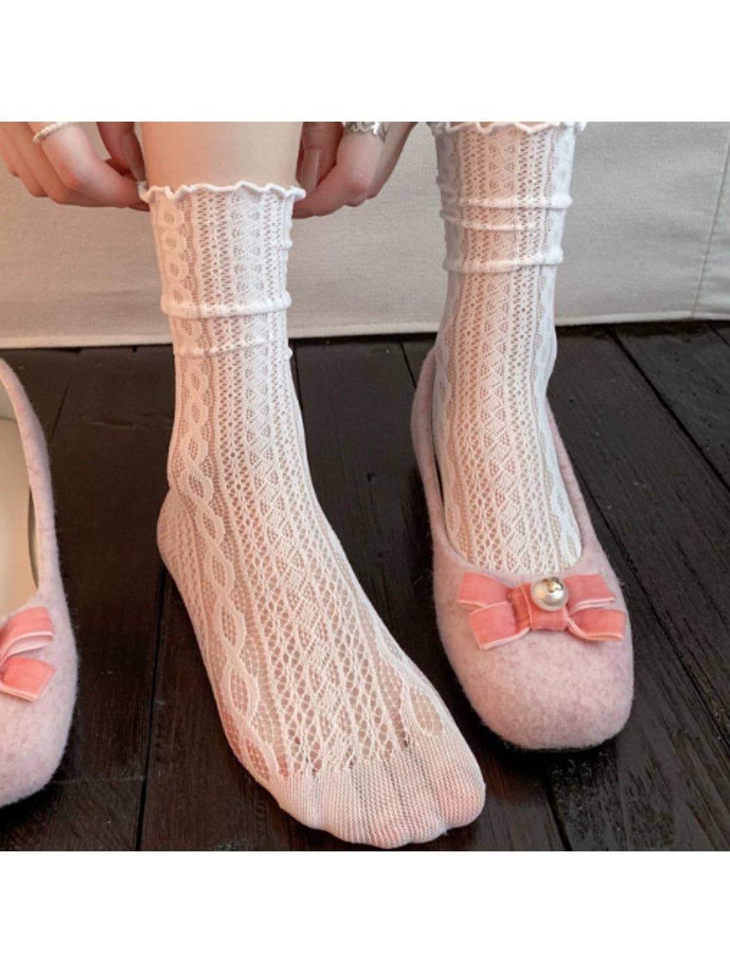 Lace ruffle socks styled with pink bow slippers