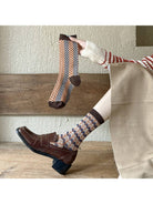 Plaid winter socks styled with brown loafers