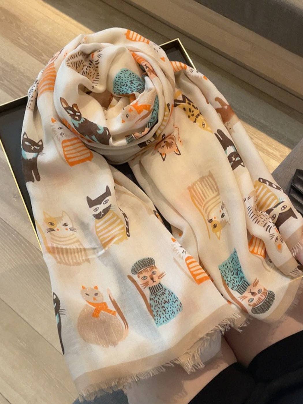 Khaki cat print scarf draped