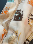 Close-up of a single illustrated cat on the scarf