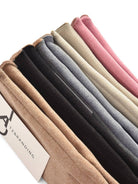 Stack of windproof touchscreen gloves in assorted colors