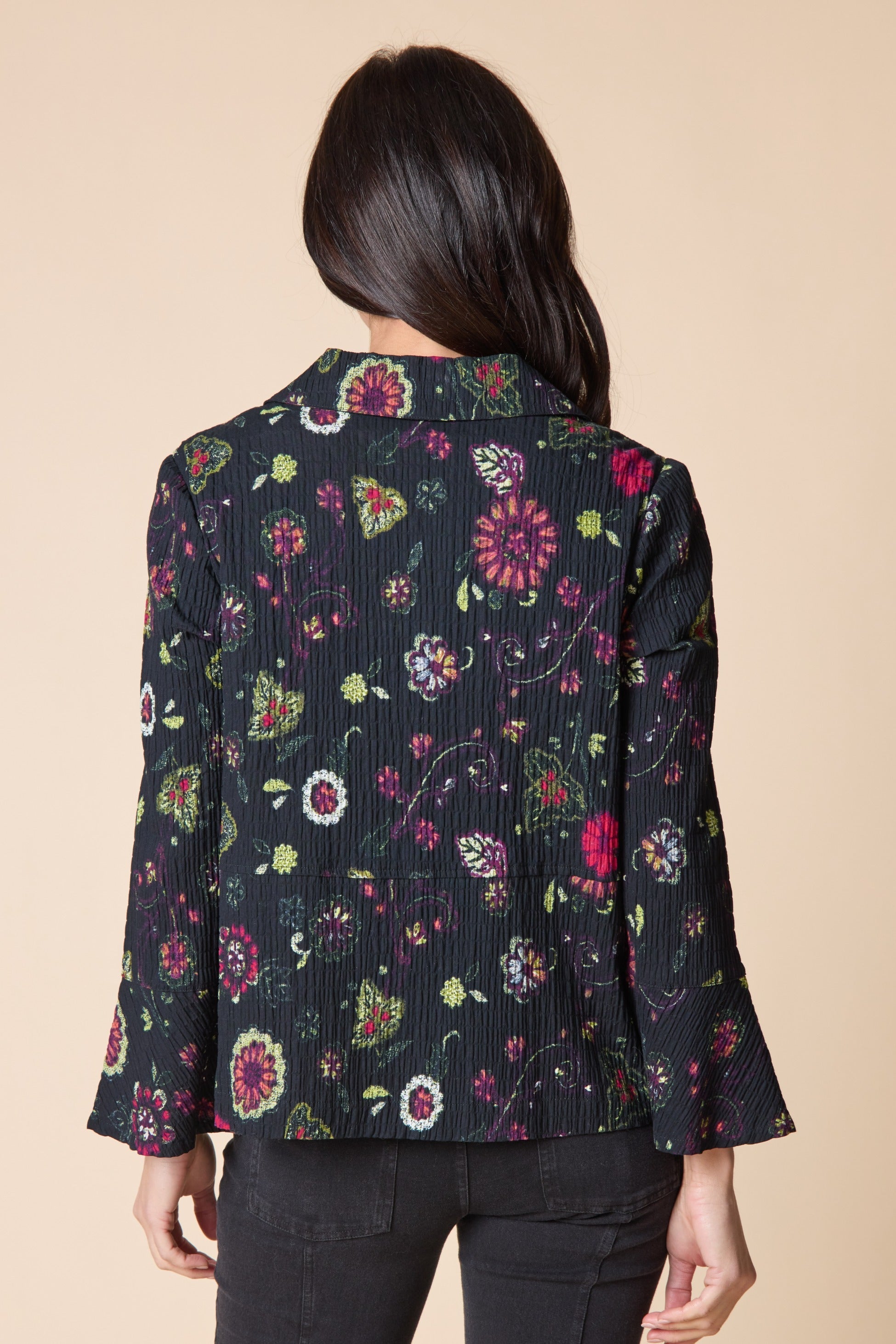 Back view of the Habitat Crinkle Floral Flounce Jacket showing the floral print and flounce sleeves