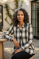Habitat Crinkle Windowpane Chill Pullover in winter white plaid, styled seated on an outdoor patio