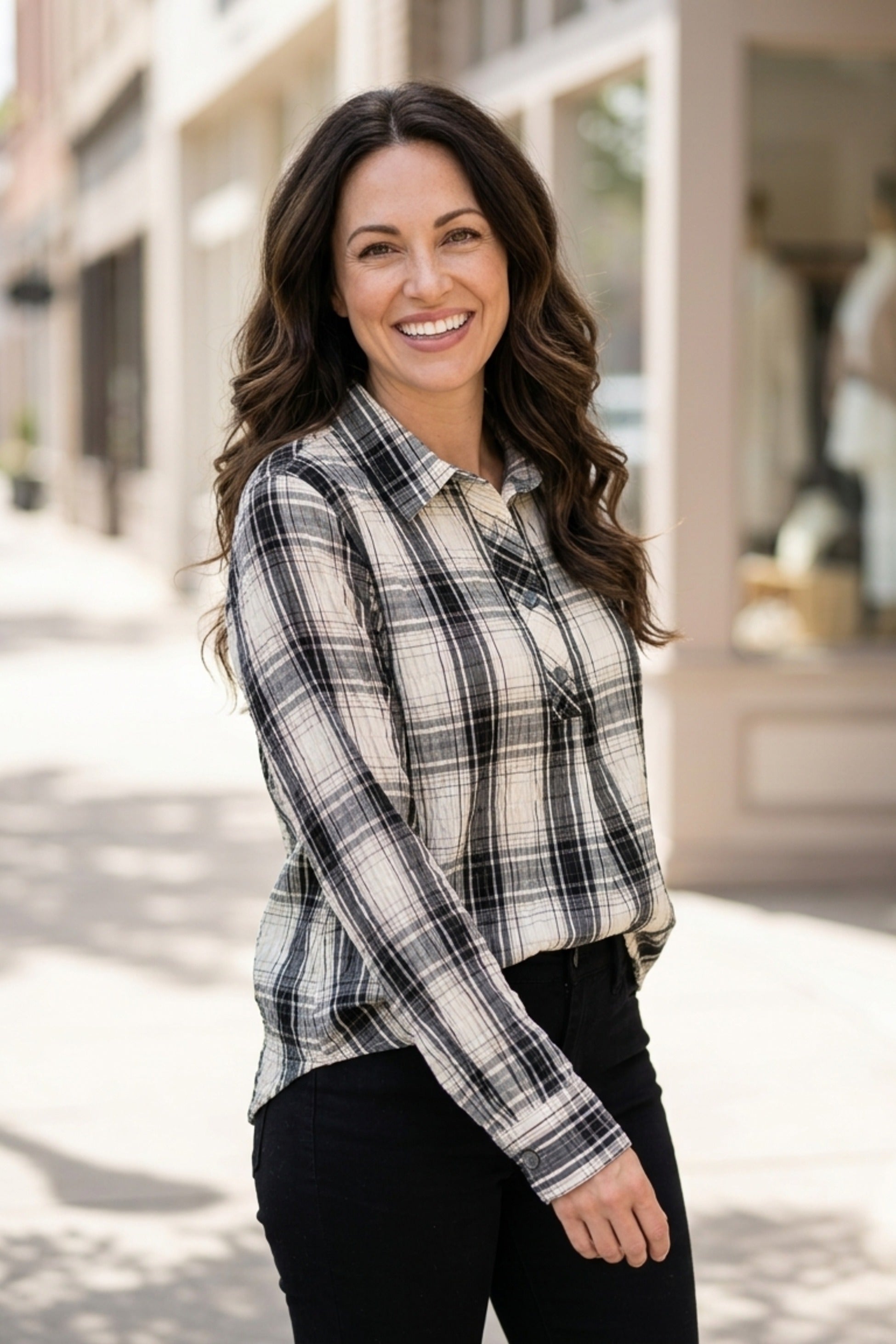 Habitat Crinkle Windowpane Chill Pullover in winter white plaid with sleeves pushed up, worn with black pants