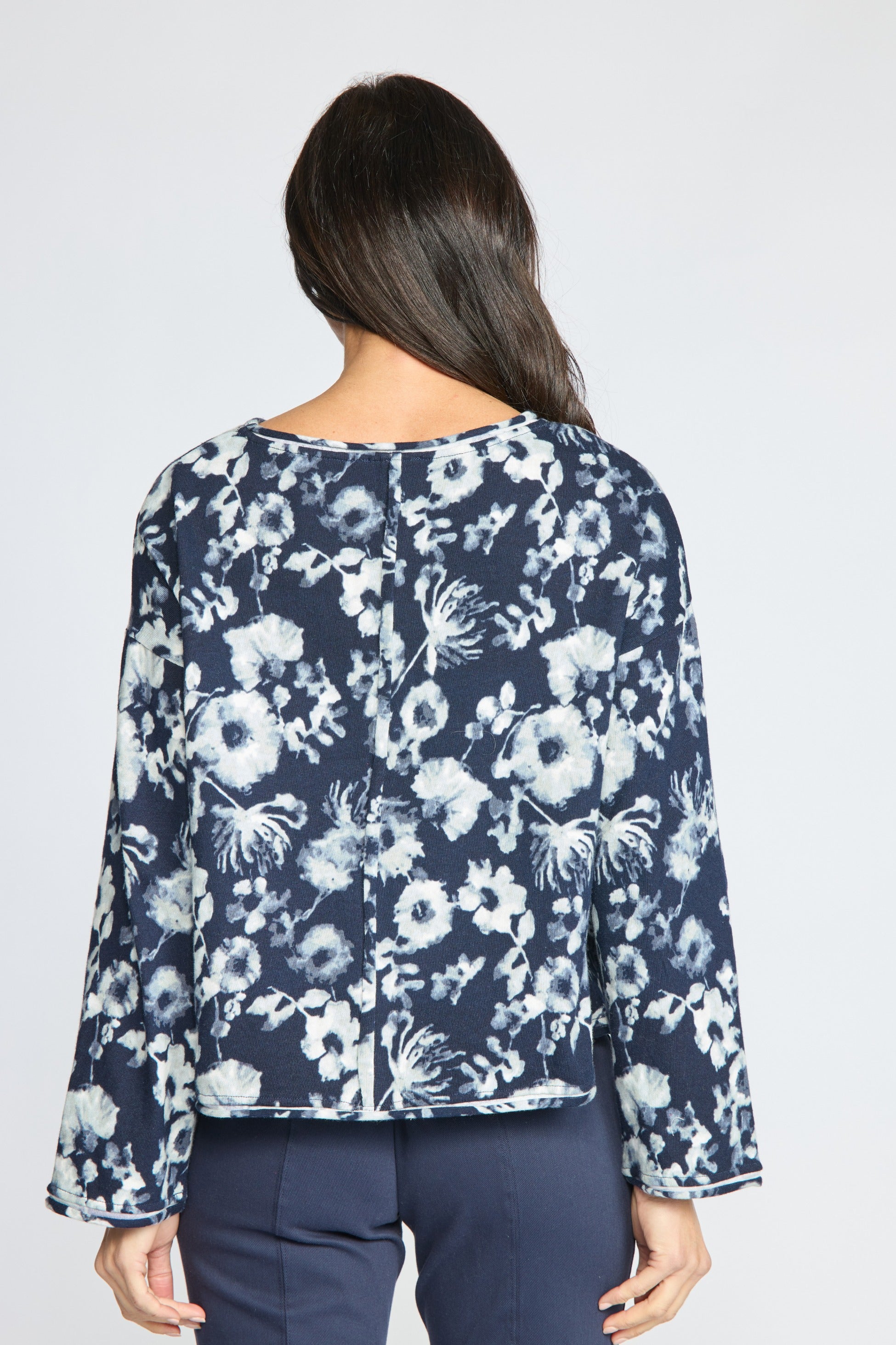 Back view of the Habitat Focus Floral Rolled Edge Pullover in navy floral print