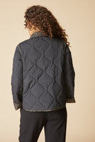 Back view of the Habitat Reversible Print Quilt Puffer Coat in black with wave quilting