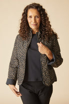 Habitat Reversible Print Quilt Puffer Coat worn open, animal print side out, three-quarter view