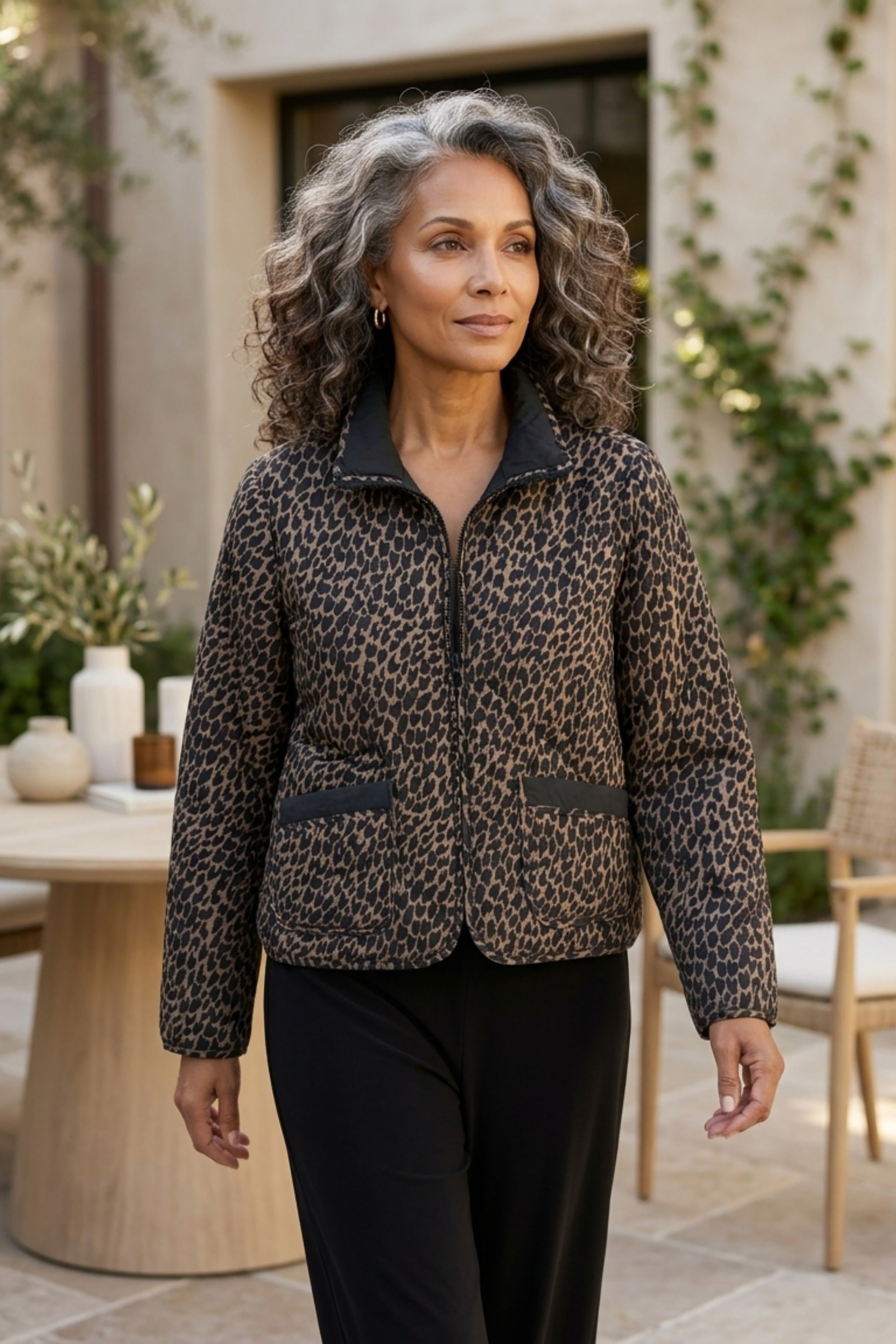 Habitat Reversible Print Quilt Puffer Coat worn animal print side out with black pants
