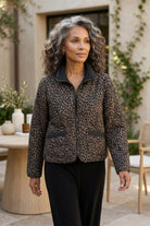 Habitat Reversible Print Quilt Puffer Coat worn animal print side out with black pants