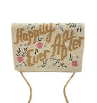 A rectangular clutch bag covered in beige beads with the phrase 'Happily Ever After' in brown script, decorated with pink flowers and green leaves, featuring a gold chain strap.