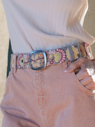 Close-up of the Jenny Krauss Heather Gray Floral Embroidered Wool Belt being worn