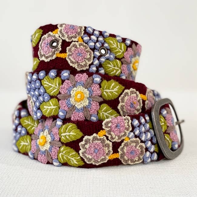Jenny Krauss Morning Glory Floral Embroidered Wool Belt in burgundy, coiled to show the hand embroidery