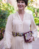 Close-up of the Jenny Krauss Morning Glory burgundy embroidered belt being worn