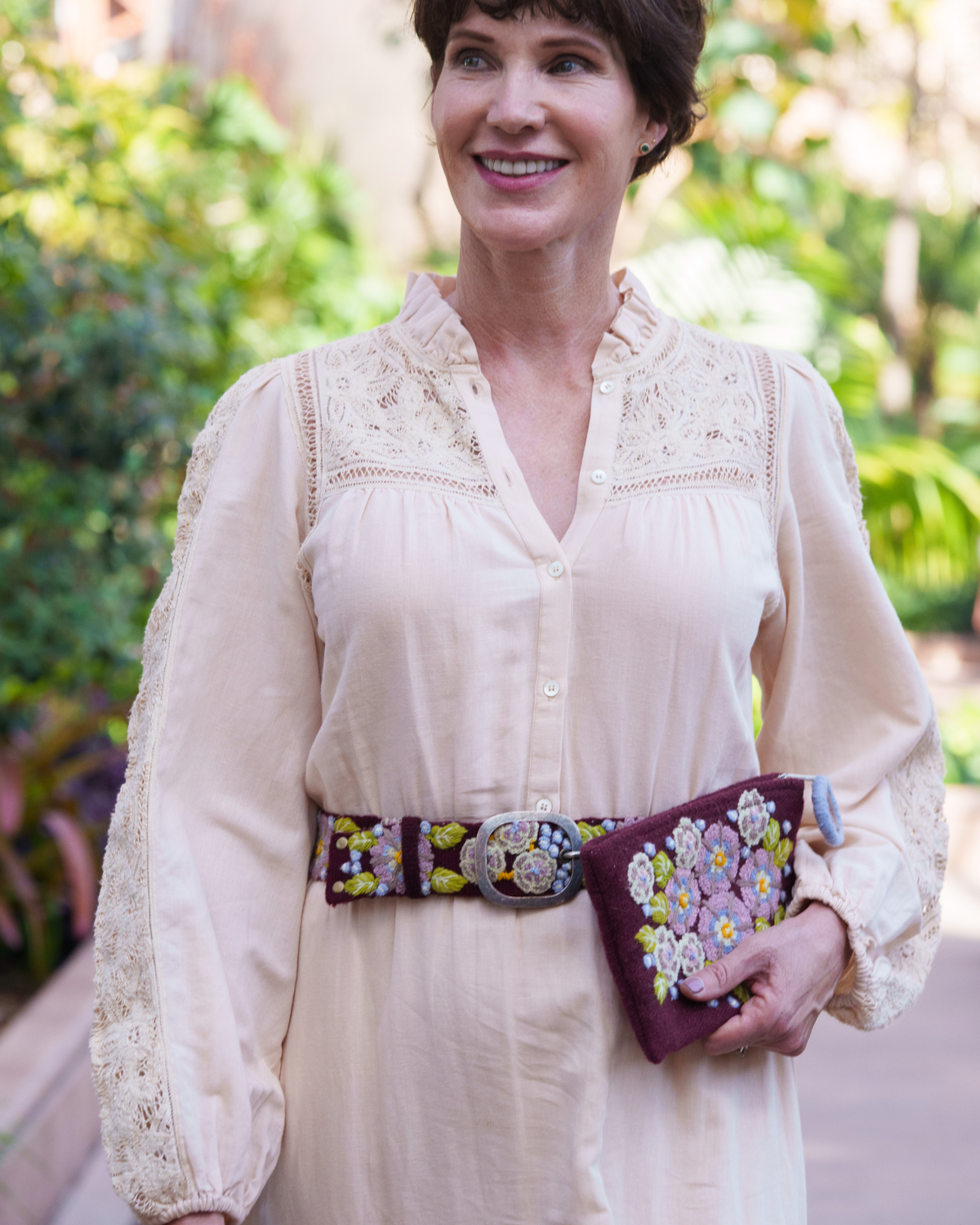 Close-up of the Jenny Krauss Morning Glory burgundy embroidered belt being worn