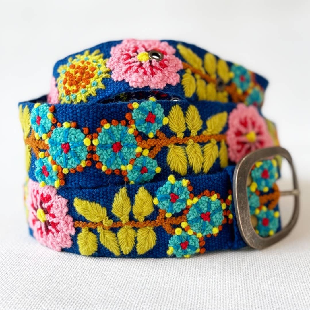 Jenny Krauss Sunshine Daydream Embroidered Wool Belt in navy, coiled to show the hand embroidery