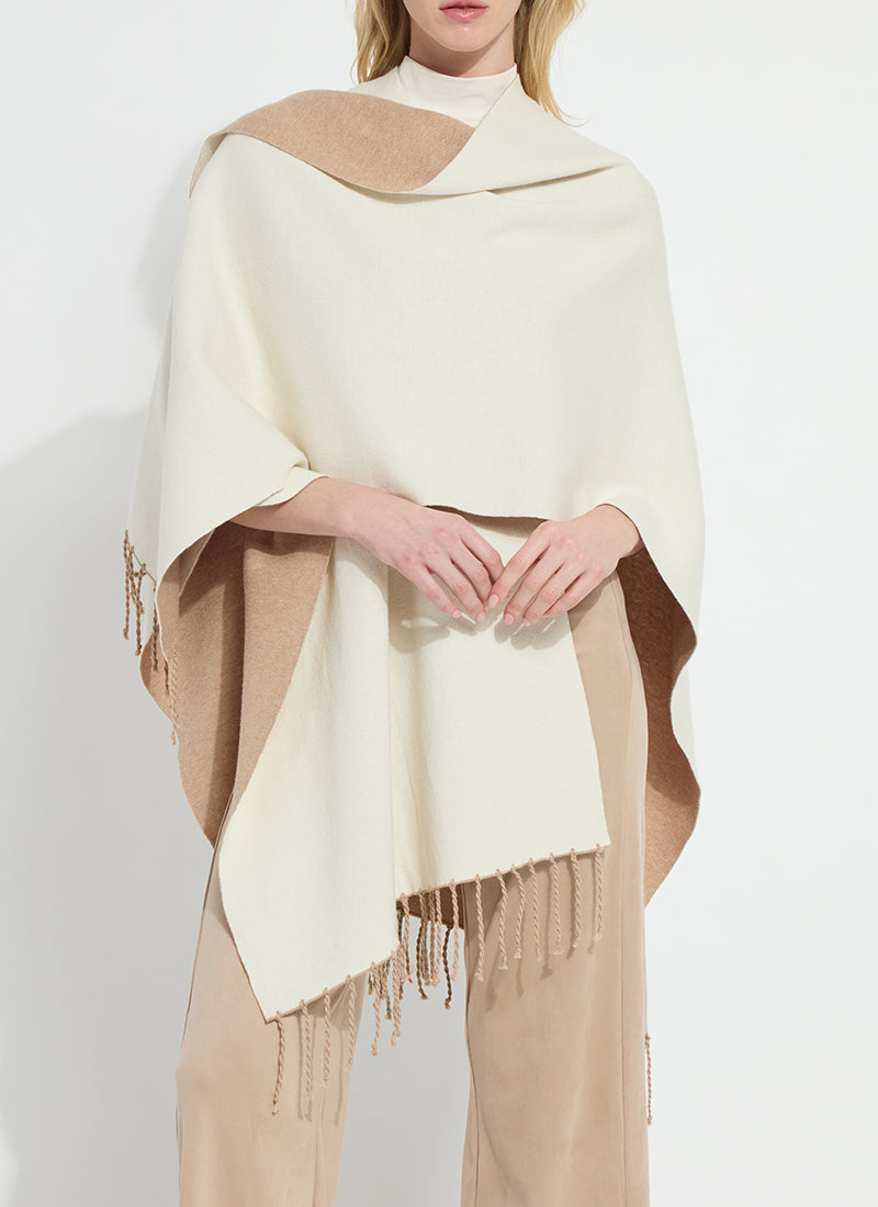 Lysse Basilia Double Face Reversible Wrap in Warm Biscuit Buttercream, draped over one shoulder showing both sides
