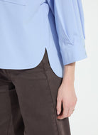 Lysse Enid Oversized Cropped Shirt in Forget Me Not Blue, close-up of the curved back hem