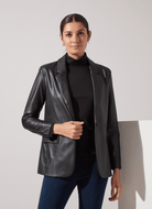 Lysse Essential Longsleeve Turtleneck in Black, styled under a black leather blazer with jeans