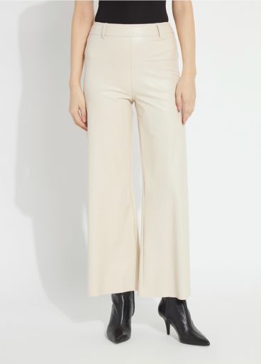 Model wearing the Lysse Hi Waist Vegan Leather Wide Leg pant in travertine cream with black pointed ankle boots