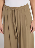 Detail view of the Lysse Mae pleated drawstring wide leg pant in olive leaf