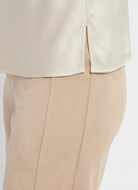 Lysse Yasmin Drape Neck Sleeveless Blouse in Travertine, close-up of the side slit hem