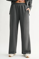 grey green wide leg sweatpants with white background