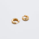 Gold vermeil hoop earrings with moon and star charm detail on a white background
