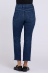 Back view of NYDJ Higher Rise Marilyn Ankle jeans in Afterhours dark indigo wash, showing five-pocket styling and cropped ankle-length hem, styled with black loafers.