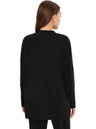 PACT Airplane Long Sleeve Poncho in black organic cotton, alternate view on model