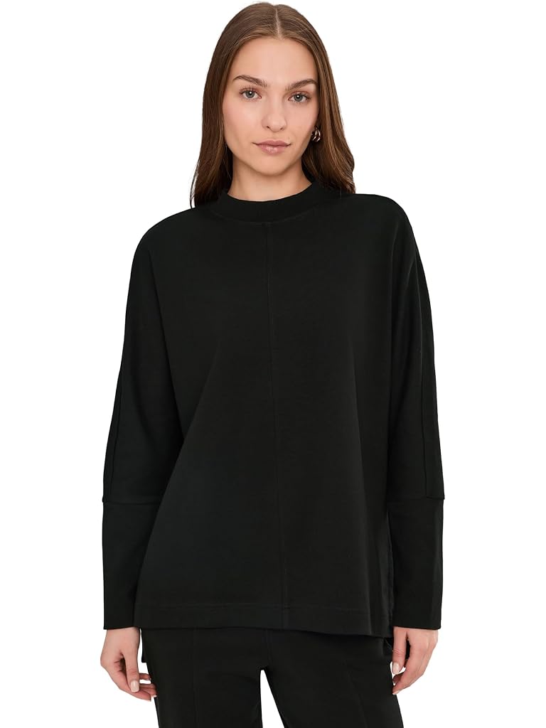 PACT Airplane Long Sleeve Poncho in black organic cotton, front view on model