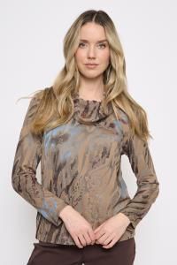 Woman wearing a patterned long-sleeve top on a white background