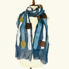 Pomegranate Moon Squares and Stripes hand-felted silk and wool scarf in blue and gray stripes with ivory and cocoa squares, displayed on a dress form