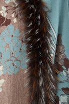 Close-up of the faux fur trim on the light blue Bloom scarf