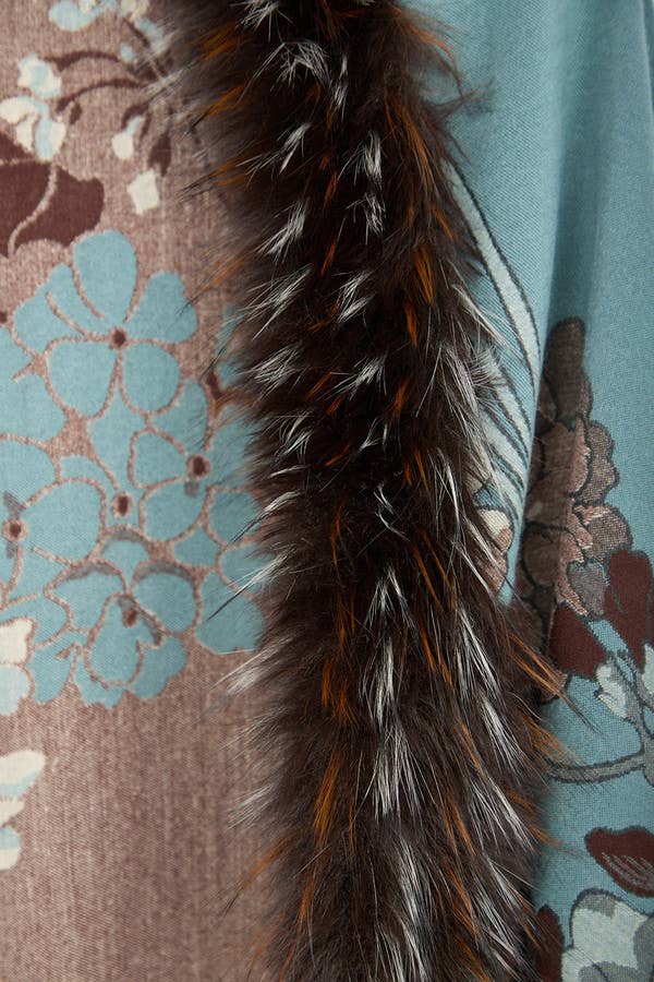 Close-up of the faux fur trim on the light blue Bloom scarf