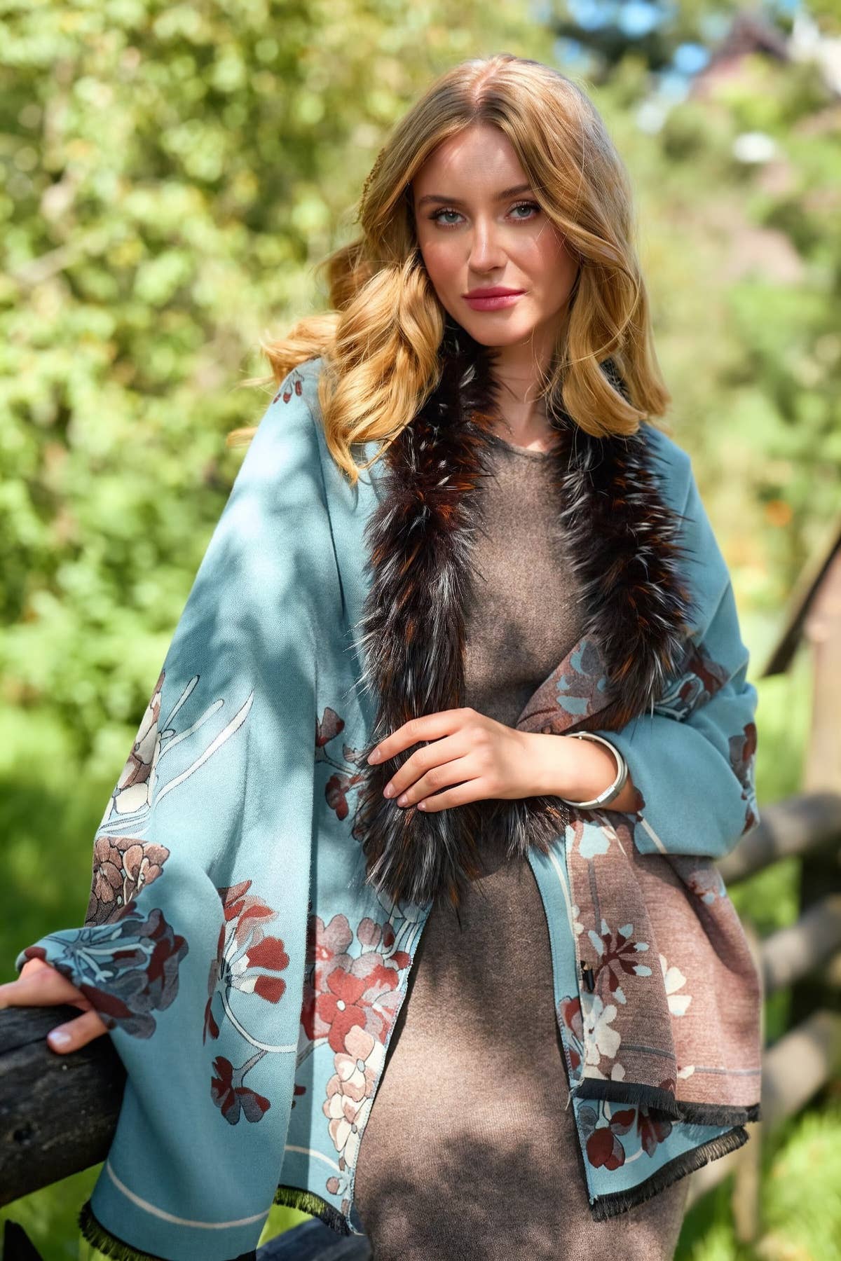 Light blue floral reversible scarf with faux fur collar worn as a wrap
