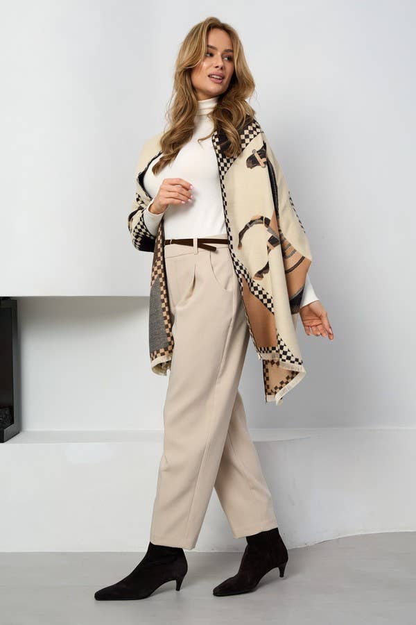 Checkered equestrian scarf worn open over cream trousers