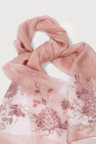 Woman wearing the blush pink embroidered sheer scarf