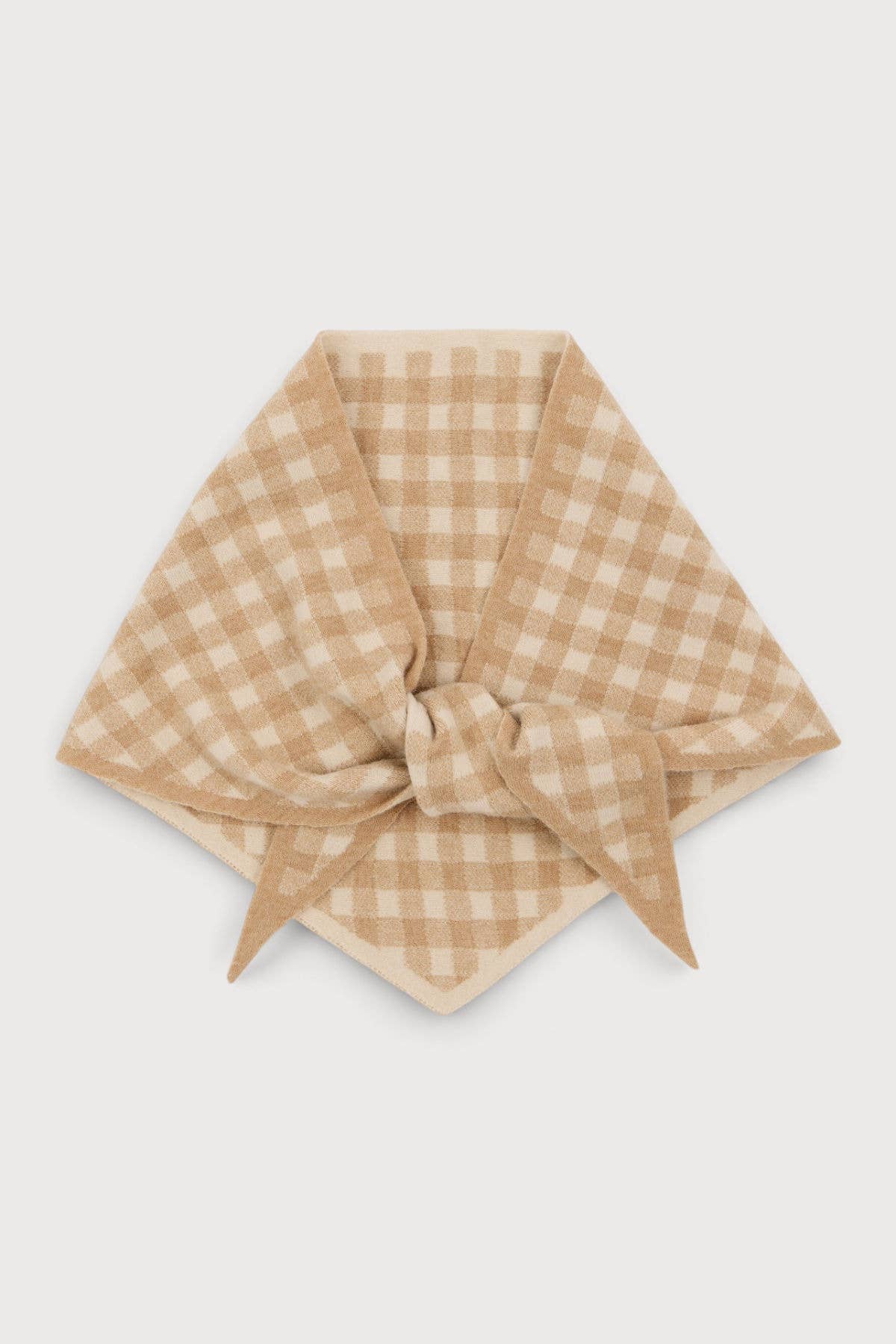 Beige gingham knit wrap styled over a sweater