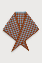 Sea blue gingham knit triangle wrap laid flat