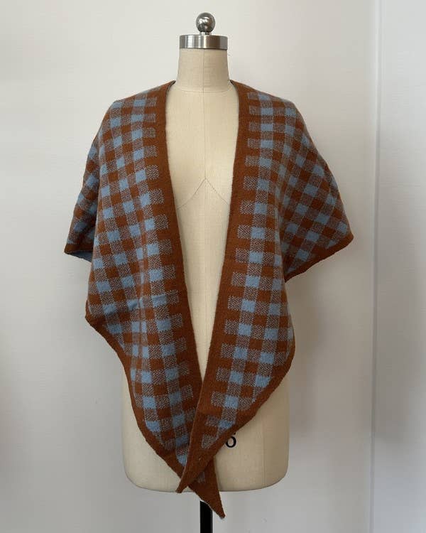 Sea blue gingham knit wrap styled over a sweater