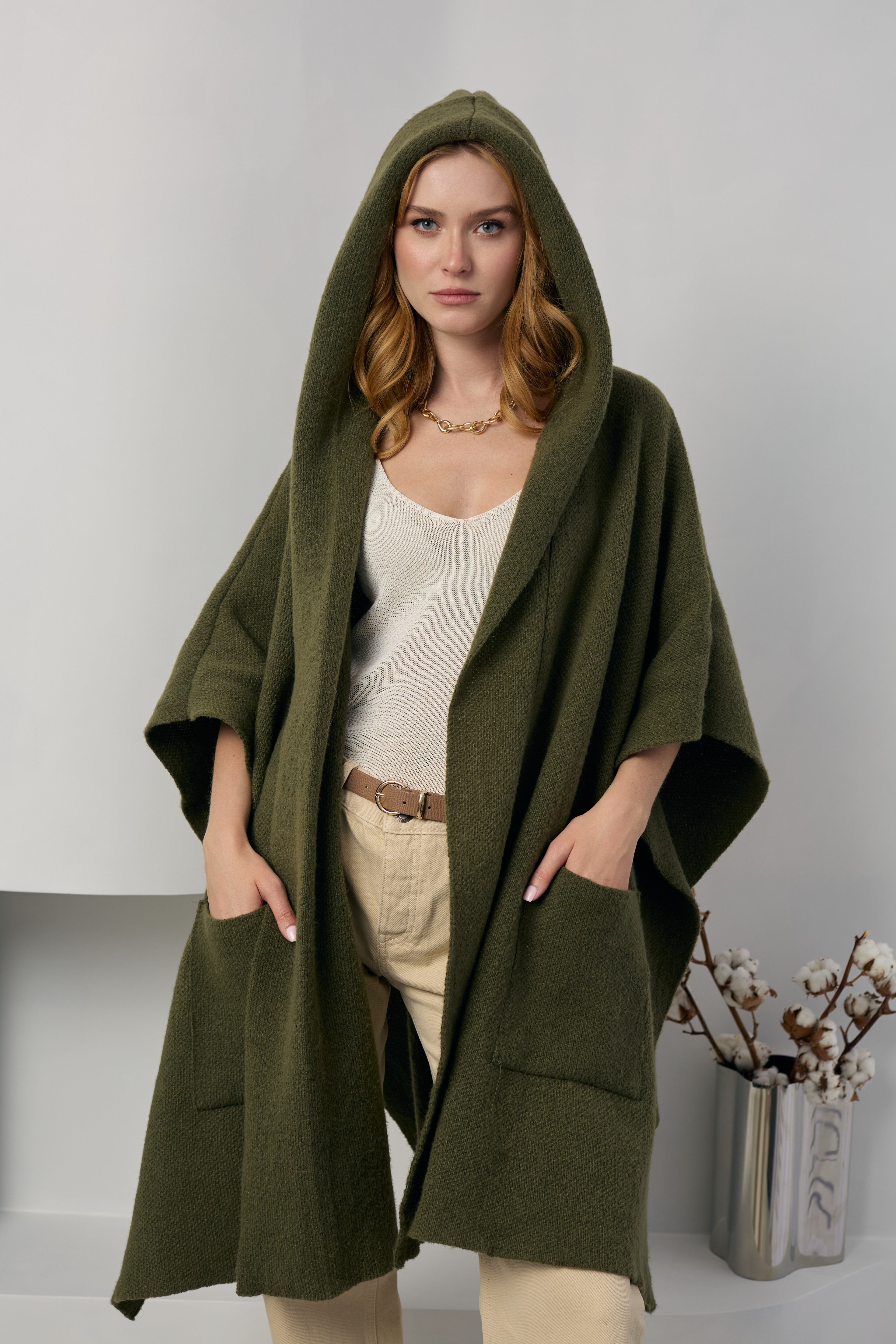 Olive hooded kimono worn with the hood up