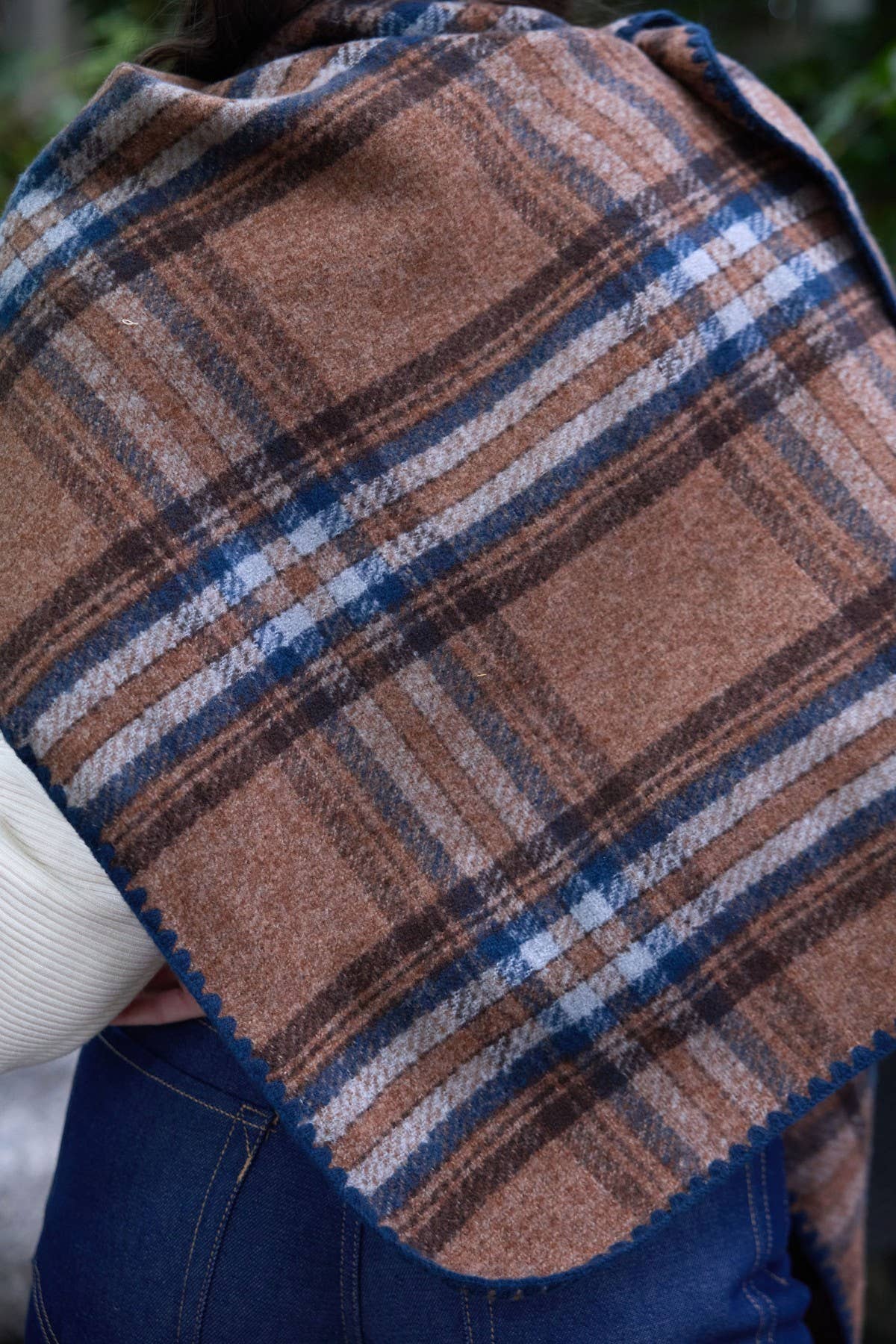 Close-up of the plaid knit and fringe