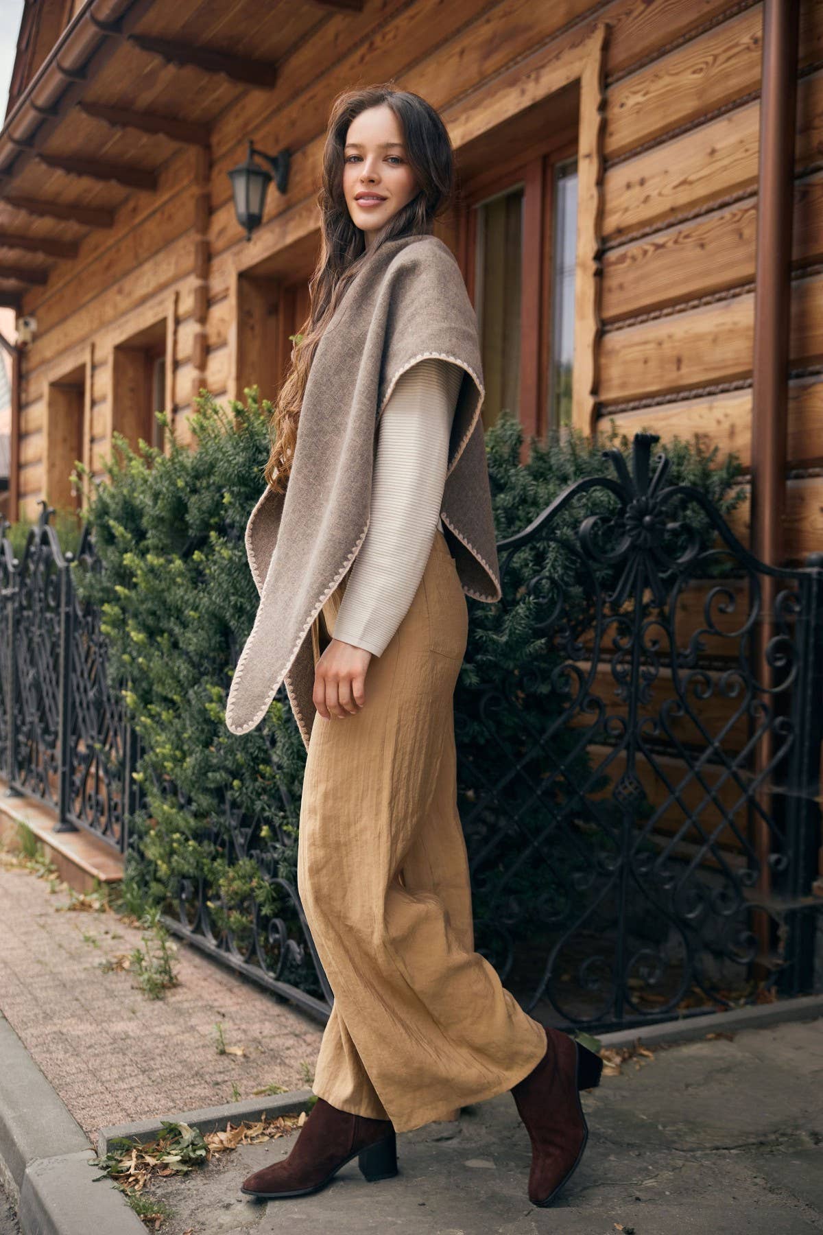 Taupe knitted triangle shawl styled outdoors