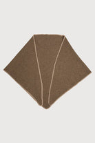 Taupe knitted triangle shawl laid flat with whipstitch edge