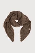 Taupe knitted triangle shawl knotted at the neck