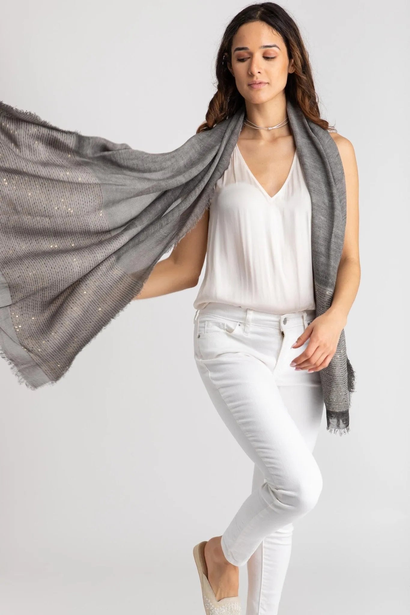 Dark grey shimmer scarf held open to show its oversized size