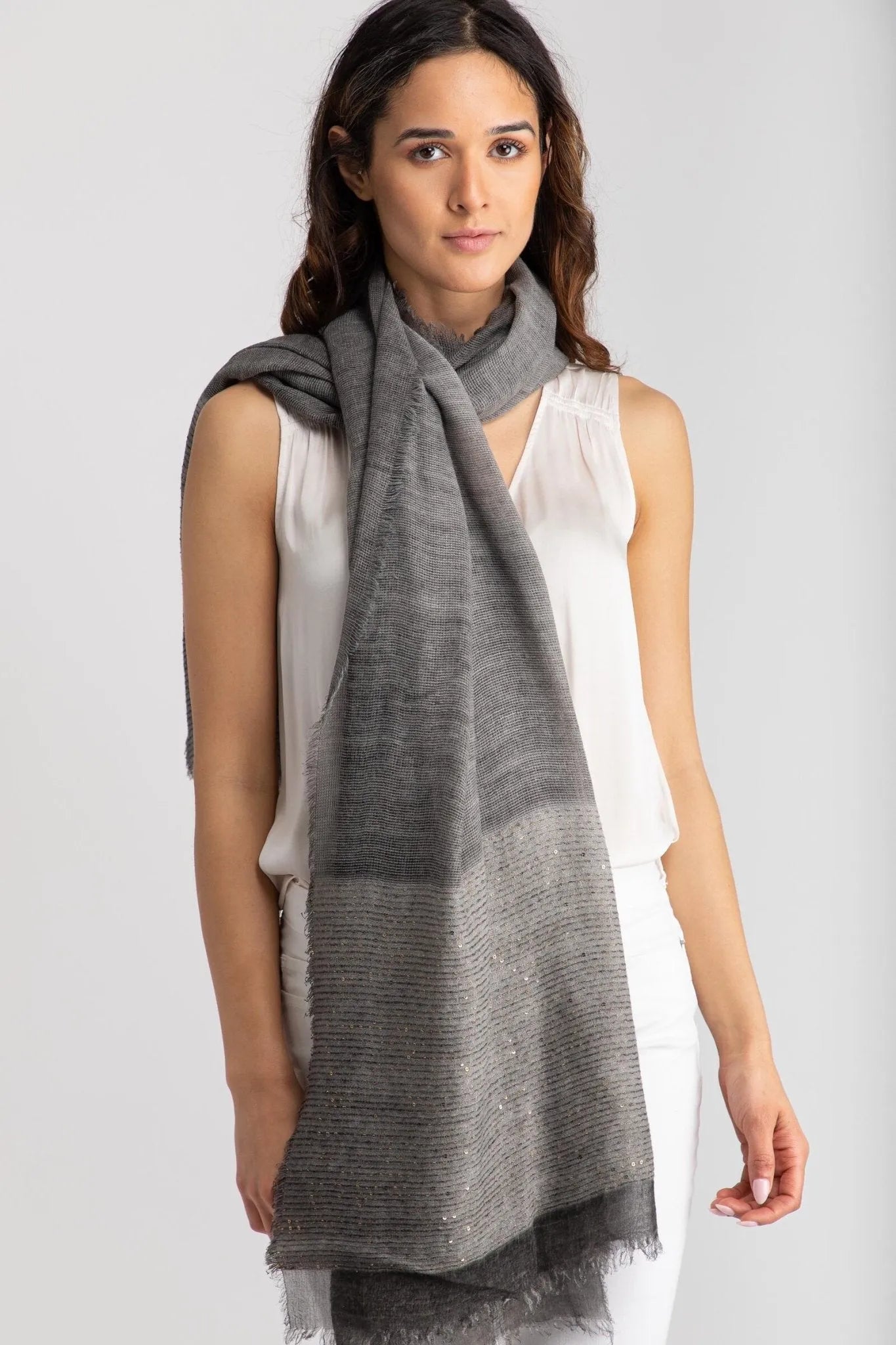 Dark grey shimmer scarf worn looped at the neck