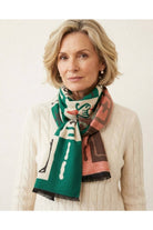 Mahjong scarf styled with a cream sweater