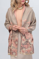 Woman wearing the taupe wildflower reversible scarf