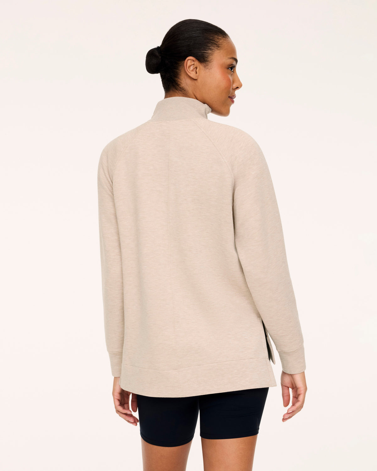 SPANX AirEssentials Brushed Half Zip Tunic, shown in Bone Heather, back view showing the longer rear coverage